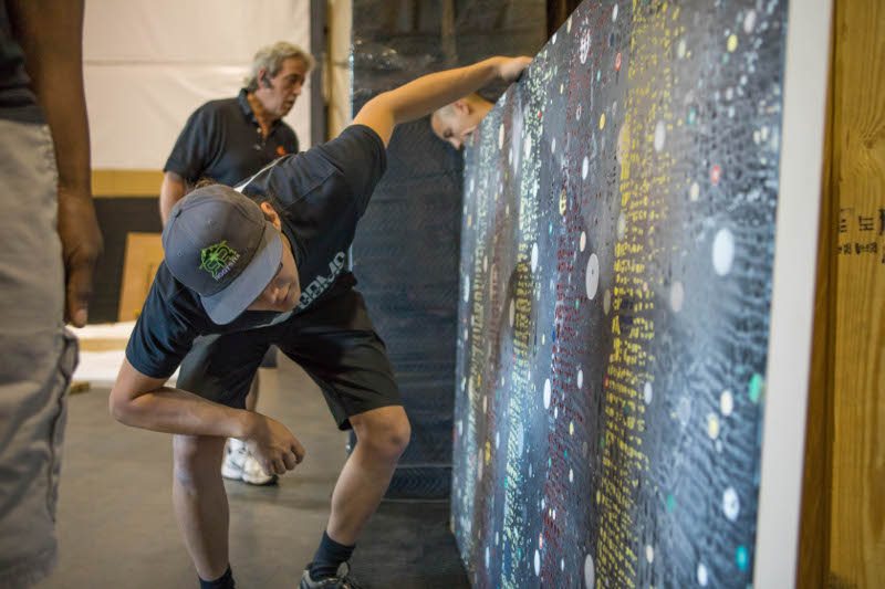 Double Diamond crew positioning a large protected artwork